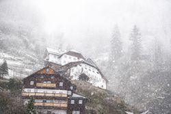 Dense snowfall over mountain village