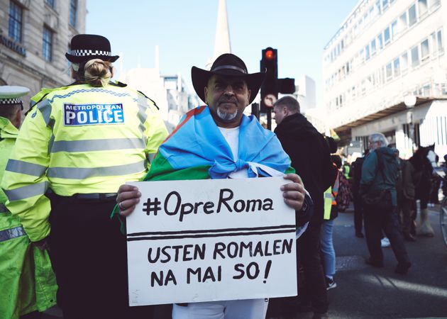 London, England, United Kingdom - March 19 2022: Man with OpreRoma sign