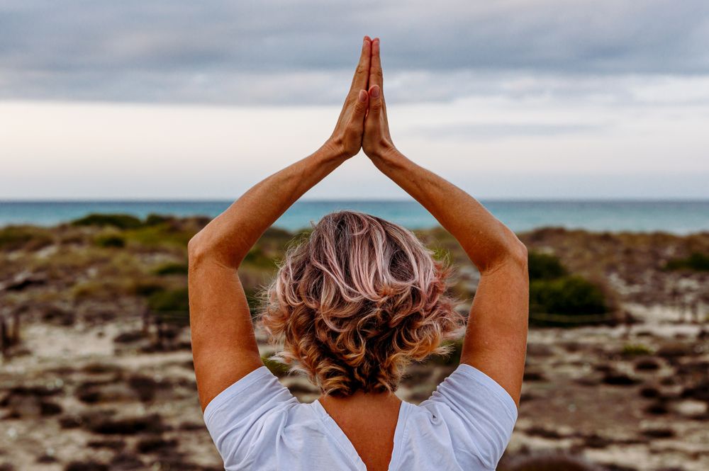 Adult woman practicing martial arts in nature