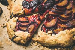 Fruit tart on parchment paper, close up