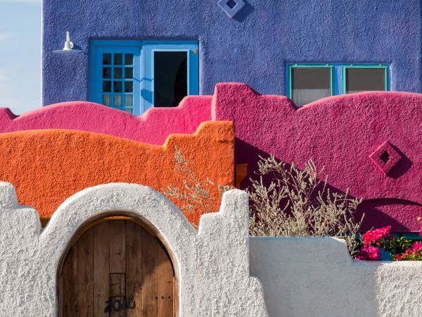 Fence of colorful house on street