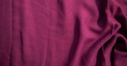 Soft purple fabric wavy crumpled background abstract with copy space
