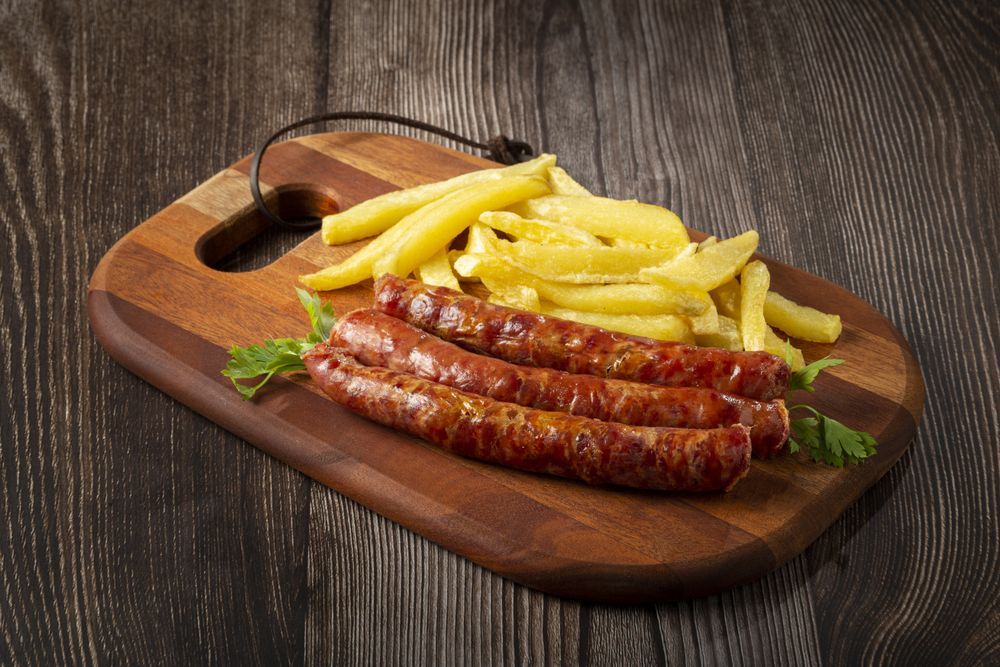 Grilled German sausage with french fries.