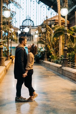 Happy couple hugging in pavilion