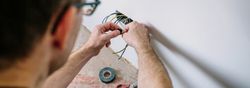 Electrician working on the electrical installation of a house