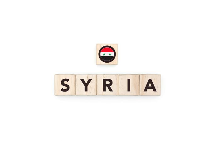 Wooden blocks bearing the name and flag of Syria.