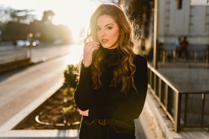 Stylish woman standing near metro station