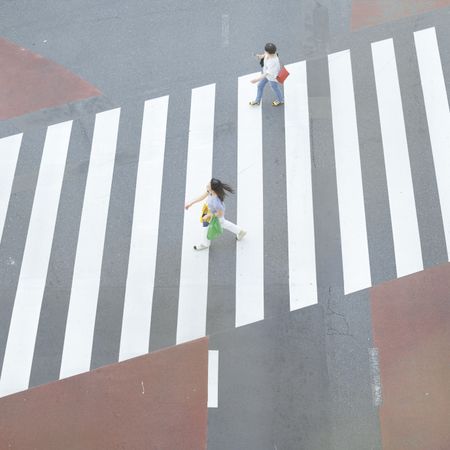 High angle view of people walking on pedestrian lane