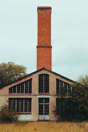 Facade of old building and cloudy sky