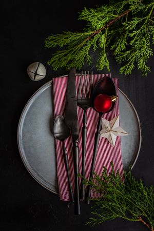 Christmas holiday concept with ornaments and red striped napkin