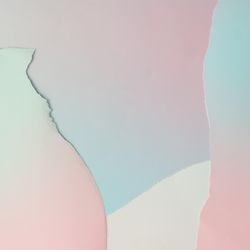 Pieces of ripped pastel colored paper in pattern