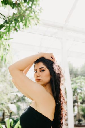 Funny female posing in garden