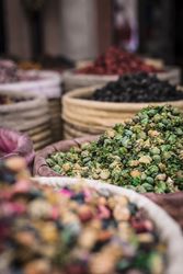 Baskets with dried spices on marketplace