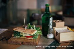 Grilled sandwich on rustic wooden board in cafe bGmqB5