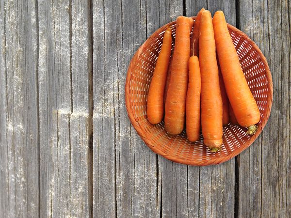 Carrots On The Wooden Background