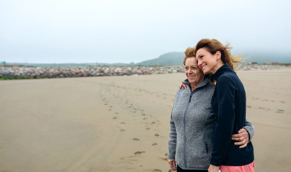 Two women looking at sea