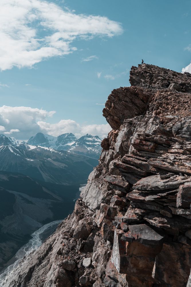 Brown rocky mountain under blue sky