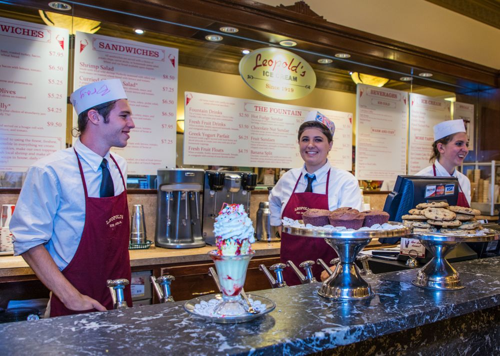 Smiling clerks at old-fashioned ice cream shop