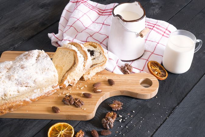Rustic breakfast with cake and milk on wooden table