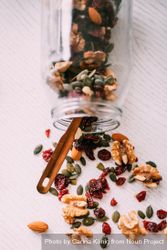 Clear mason jar storing a holiday mix of cranberry, nuts and seeds k4ME4Y