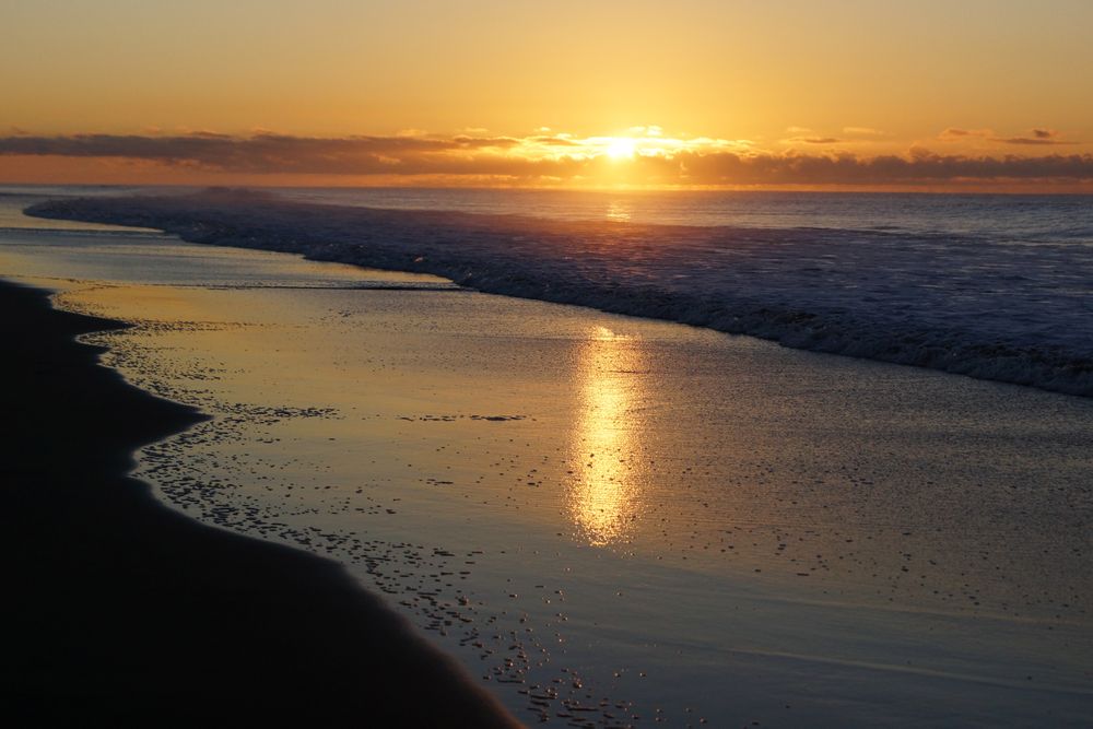 Colorful sunset over peaceful seashore