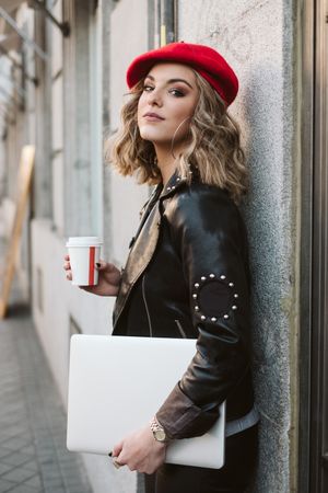 Woman with drink on the street