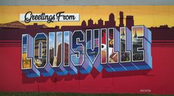 Large sign on the wall of a business in downtown Louisville, Kentucky