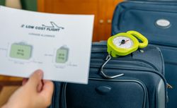 Low cost airlines luggage restrictions and baggage on background