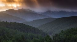Sunset over hilly terrain