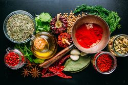 Assorted spices near fresh oil