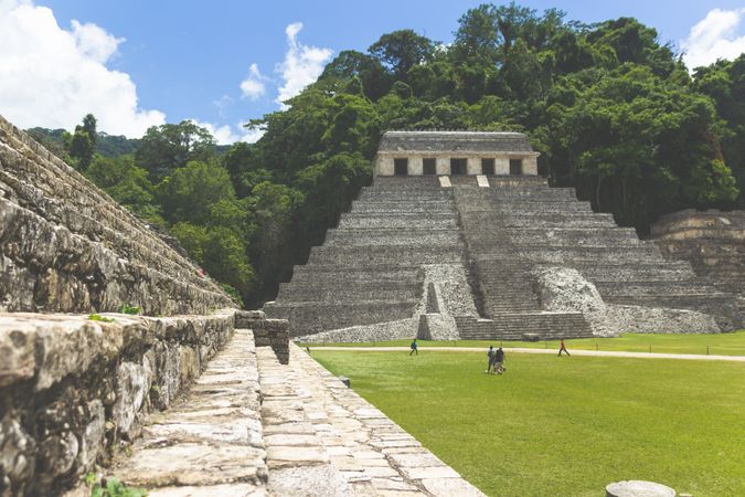 People walking beside Mayan's pyramid