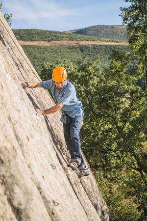 Free climber climbing in nature