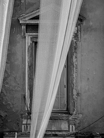 Partial cover of facade conservation of run down villa on the Blvd d'Italie, Monaco
