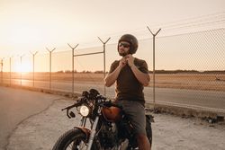 Strong man driving motorcycle