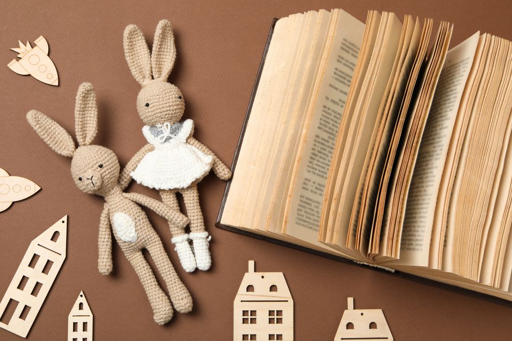 A children's book with toys on a beige background.