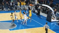 Black Basketballer Scores a Successful Dunk with One Hand