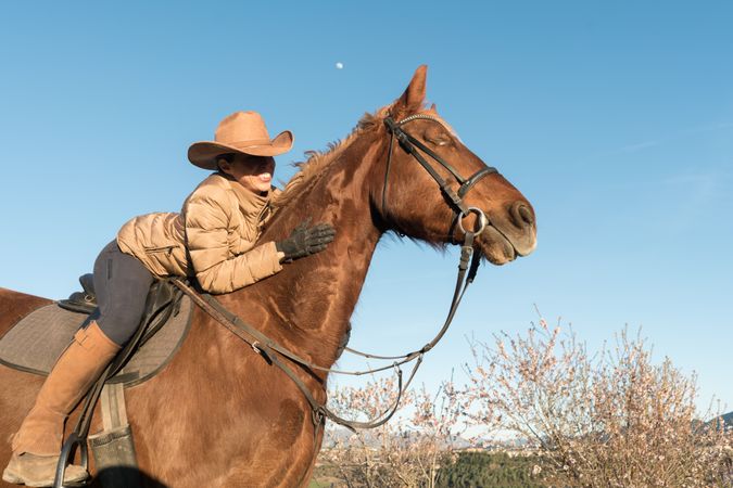 Woman on horse in field