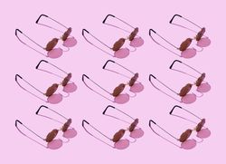 Sunglasses on pink background