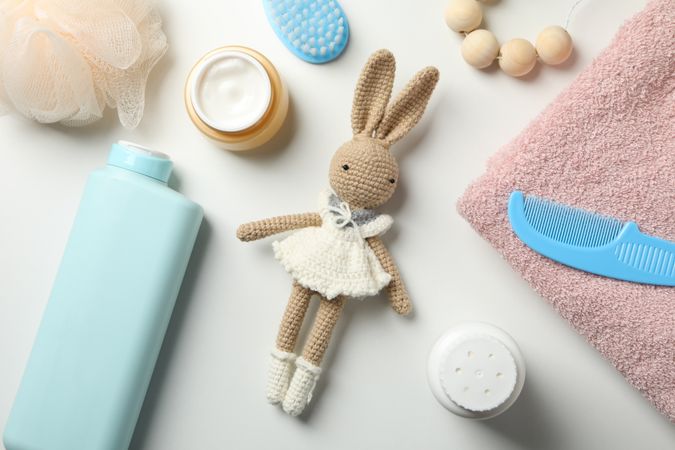 Baby hygiene accessories on light background, top view