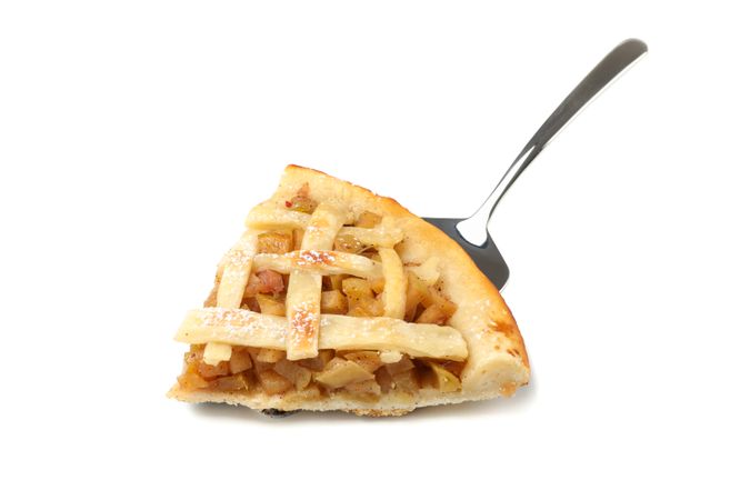 Shovel with piece of tasty apple pie isolated on plain background