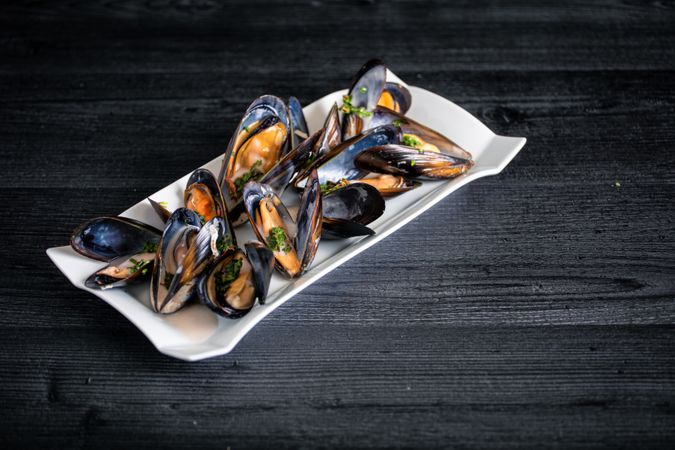 Steamed mussels with Thai sauce in plate