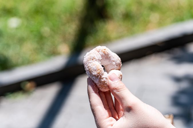 Sugar donuts in the hand of cute boy