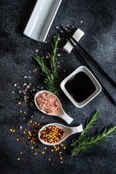Asian table setting with chopsticks and rosemary