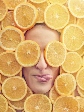 Woman in slices of orange