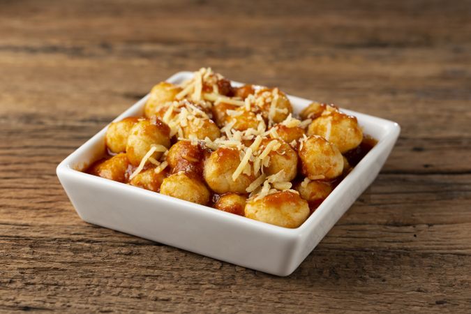Gnocchi with tomato sauce and grated Parmesan cheese.
