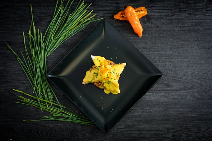 Corvina with yellow pepper sauce in plate