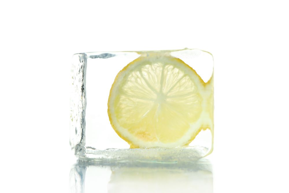 Clear ice cube with lemon slice