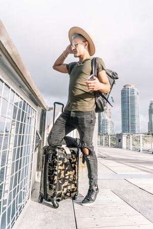 Full length of a traveller young man, taking the time to explore the city