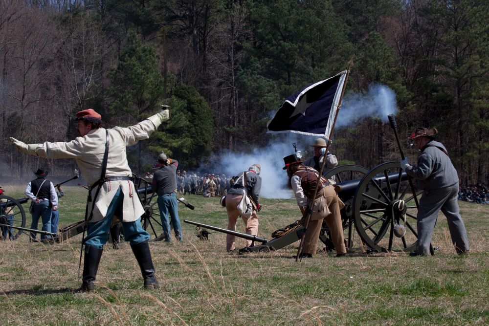 Costumed actors on field during historical Civil War reenactment