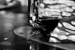 Close up of sewing machine on batik Indonesian fabric